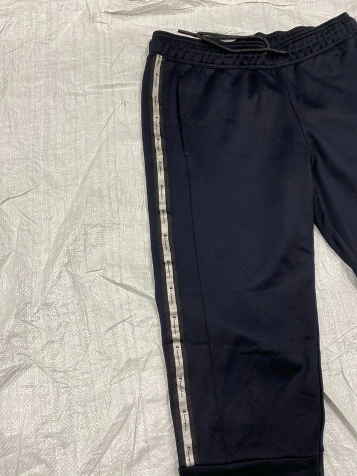 Champion Joggers deep blue leg graphics. Small